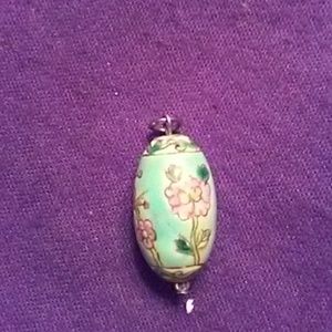 A hand crafted necklace pendandt.